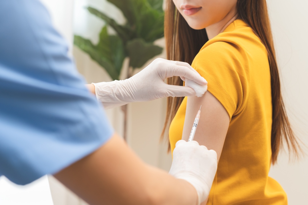 Health care, corona virus, hand of woman nurse, doctor giving syringe vaccine, injection dose on arm sick patient at clinic. Vaccination, immunization disease prevention against flu pandemic influenza